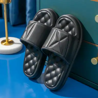 Stylish black slip-on slides featuring quilted cushioning for ultimate comfort, perfect for indoor wear. Shop luxury and comfortable sandals at Monalisa Store for a modern and chic look.