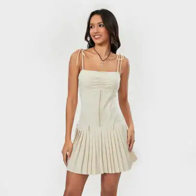 Stylish beige women's dress with adjustable ties, square neckline, and pleated skirt, perfect for casual wear, parties, or special occasions.
