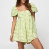 Light green gingham puff sleeve dress for women, perfect for casual summer wear and beach outings. Comfortable, stylish, and breathable fabric for an effortless summer look.