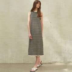 Elegant black and white striped sleeveless maxi dress, perfect for casual or summer wear, offering comfort and style.