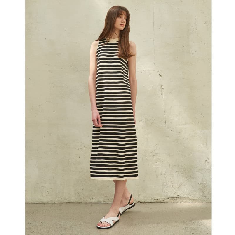 Elegant black and white striped maxi dress perfect for summer and casual outings, featuring sleeveless design and comfortable fit.