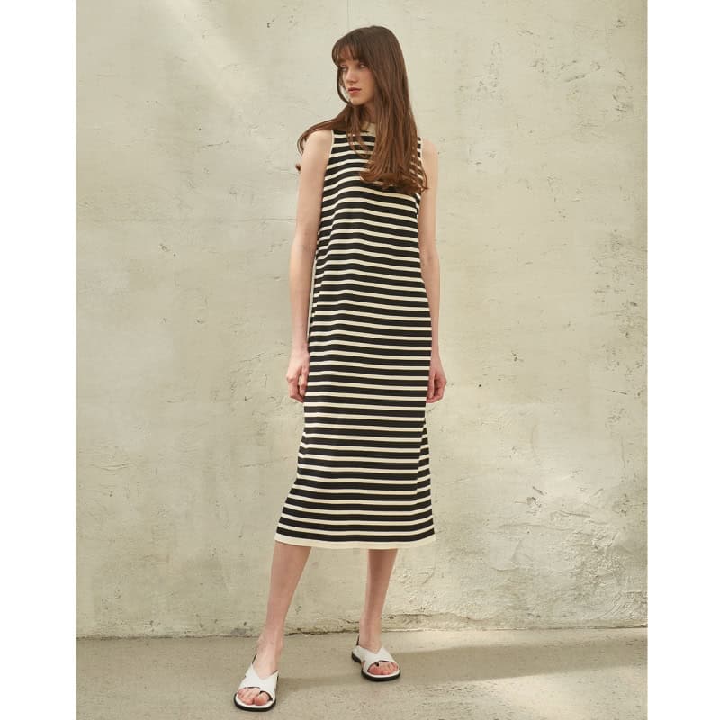 A stylish black and white striped sleeveless maxi dress perfect for casual occasions, available at Monalisa Store for fashionable women.