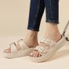 Comfy beige open-toe sandals with adjustable straps, perfect for casual wear and style. Lightweight, versatile, ideal for spring and summer outfits.
