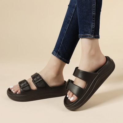 Slide sandals with adjustable straps and thick sole for women’s comfort and style, perfect for casual outings.
