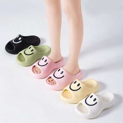 Cute smiley face slippers in multiple colors, perfect for comfortable indoor wear, stylish loungewear, and casual home footwear for women and men.