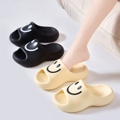 Cheerful smiley face slippers perfect for comfort and style in eye clinics or wellness settings. Available in black and beige, these slippers add a fun touch to your eye treatment experience.