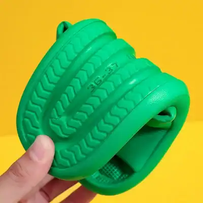 Durable green eyeglass cleaner with textured grip, compatible with all lens types, easy to use, portable, and effective for maintaining clear vision. Perfect for travel and daily care.