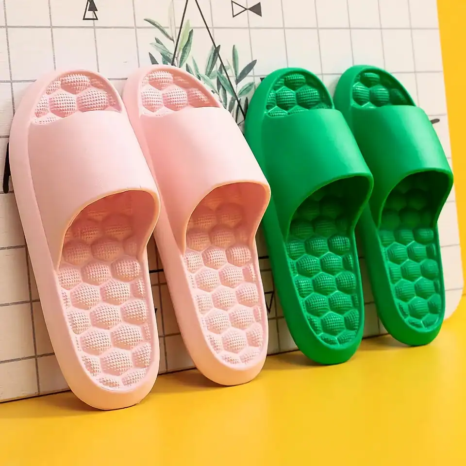 Colorful slide slippers with ergonomic insole design for optimal foot support, ideal for casual wear and indoor use.