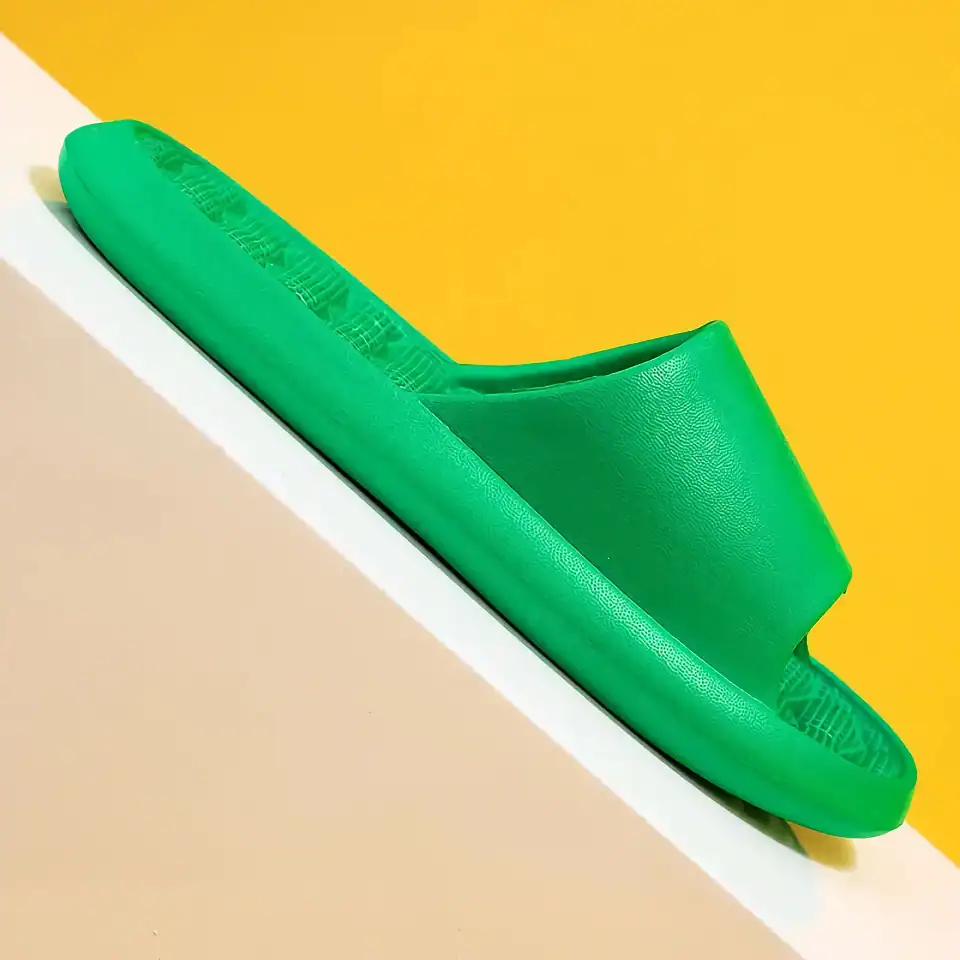 Lightweight green slippers ideal for medical clinics and spa settings, providing comfortable foot support and easy slip-on design.