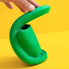 A vibrant green silicone earbud holder with a modern design, perfect for organizing and protecting wireless earbuds. Compact, lightweight, ideal for travel or everyday use at Monalisa Store.