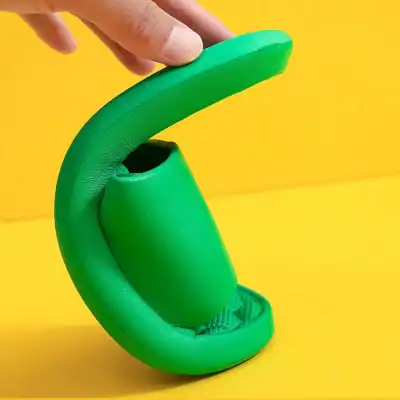 A vibrant green silicone earbud holder with a modern design, perfect for organizing and protecting wireless earbuds. Compact, lightweight, ideal for travel or everyday use at Monalisa Store.