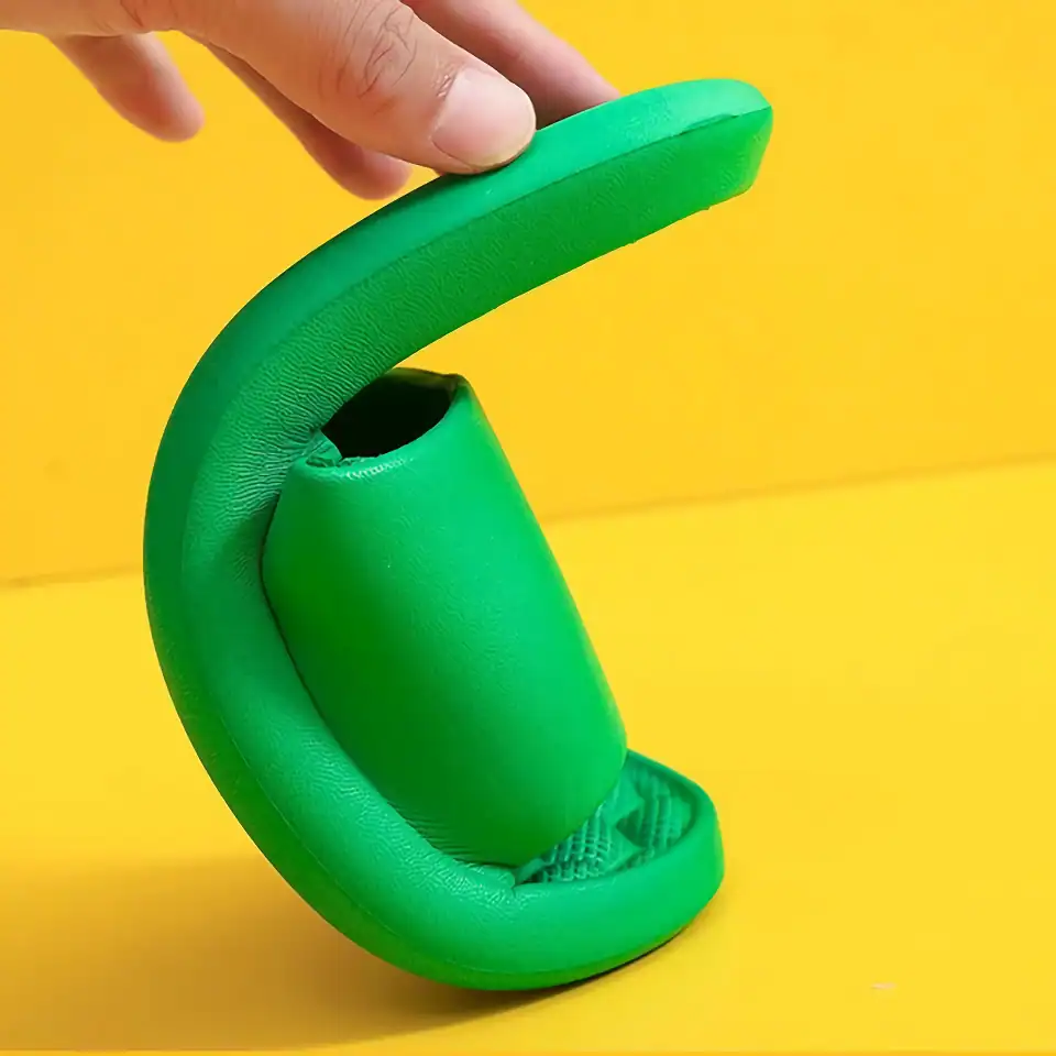 A vibrant green silicone earbud holder with a modern design, perfect for organizing and protecting wireless earbuds. Compact, lightweight, ideal for travel or everyday use at Monalisa Store.