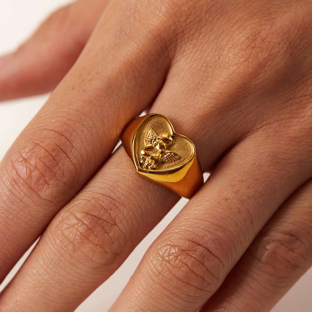 Delicate gold ring featuring angelic details, perfect for jewelry lovers seeking stylish and meaningful accessories.