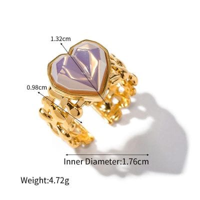 Elegant gold ring featuring a purple heart-shaped gemstone, perfect for special occasions or fashion accessories.