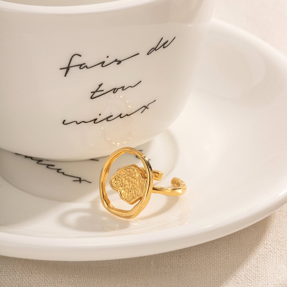 Gold ring featuring a distinctive textured face design, perfect for stylish accessories or gift ideas, available at Monalisa Store.