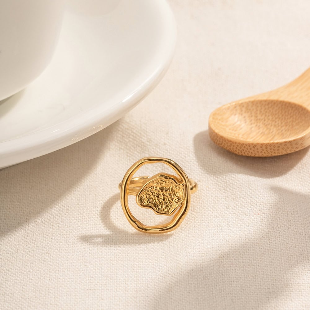 Luxurious gold ring featuring an intricate, artistic design, perfect for elegant accessories or special occasions. Showcases high-quality craftsmanship and unique style.