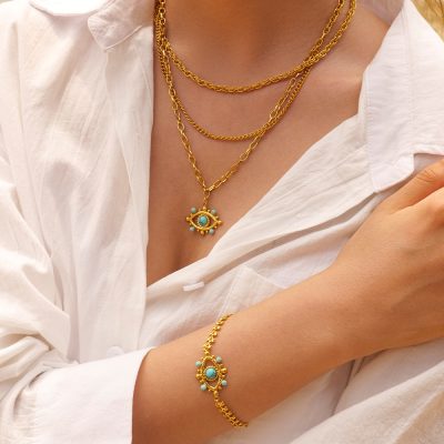 High-quality gold necklace and bracelet featuring turquoise stones, perfect for stylish jewelry lovers and fashion statements. Bulgari-inspired jewelry ideal for special occasions.