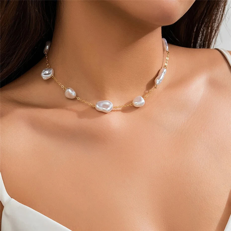 Elegant white pearl necklace with gold chain, perfect for stylish jewelry lovers. Enhance your look with Monalisa Medical's exquisite accessories.