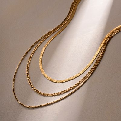 Various gold layered necklaces displayed for women’s jewelry collection.