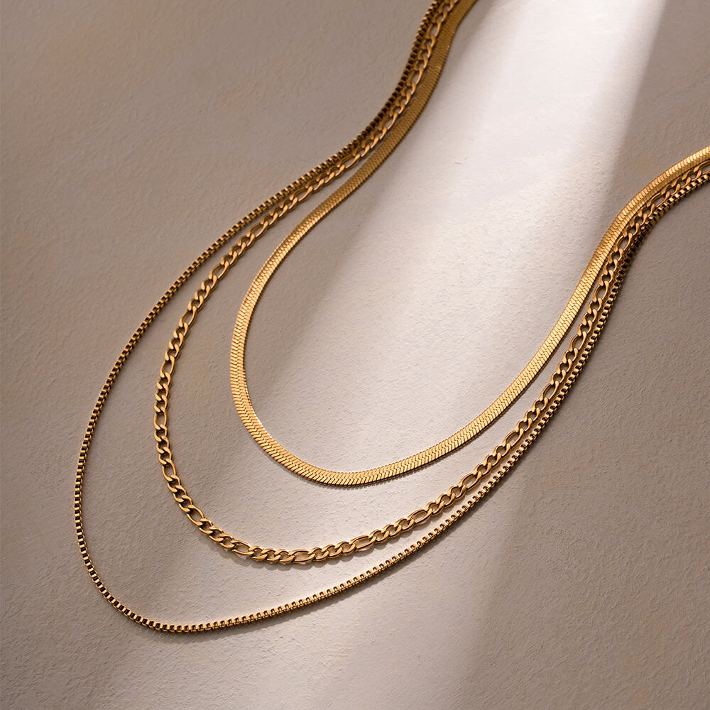 Various gold layered necklaces displayed for women’s jewelry collection.