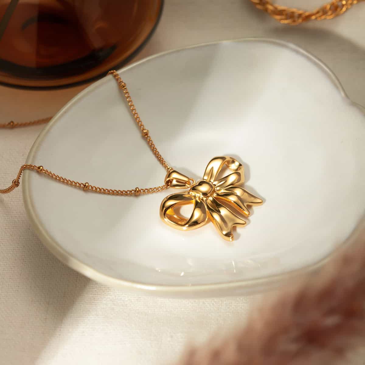 Gold flower pendant necklace with chain, stylish jewelry for women and gifting accessories. Perfect for enhancing your fashion statement and special occasions.