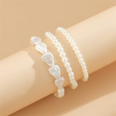 Delicate pearl bracelets displayed on a arm model, highlighting stylish and elegant jewelry options available at Monalisa Store.