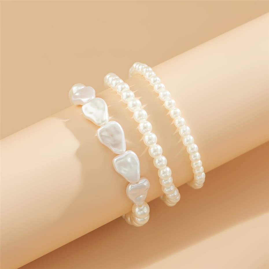 Delicate pearl bracelets displayed on a arm model, highlighting stylish and elegant jewelry options available at Monalisa Store.