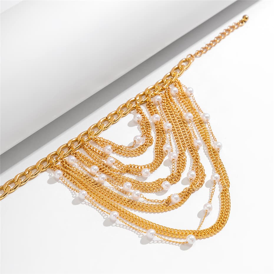 Stunning gold chain necklace adorned with white pearls, perfect for adding luxury and style to any look. Ideal for jewelry lovers seeking quality and fashion.