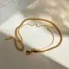 Luxurious gold necklace and bracelet, perfect for fashion and special occasions. Crafted with high-quality gold, adding a touch of elegance and sophistication to any outfit.