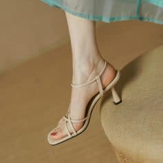 Striking beige women's high heel sandals with multiple straps, perfect for stylish occasions. Comfortable and fashionable footwear available at Monalisa Store for women seeking chic summer shoes.