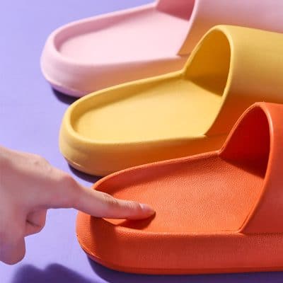 Brightly colored slip-on sandals suitable for women’s casual summer outfits, made from comfortable materials for everyday wear.