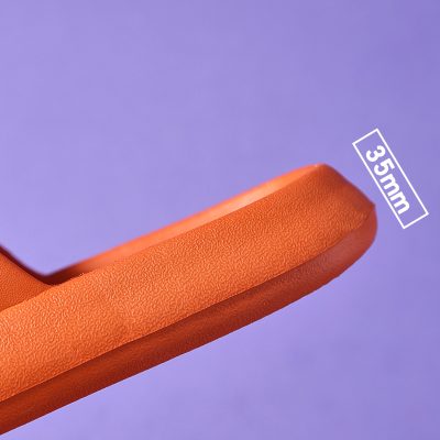 Close-up of an orange eyeglasses frame showcasing durability and style for optical customers.