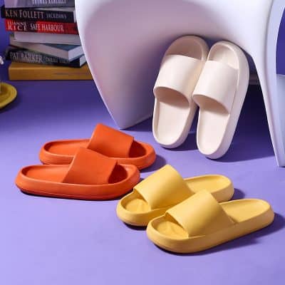 Bright orange and yellow slides with a sleek design for casual comfort and style. Perfect for home, beach, or relaxed outings, adding vibrant color to your wardrobe.