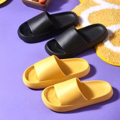 Comfortable black and yellow slides for casual wear and beach outings. Easy slip-on design perfect for relaxed, everyday style.