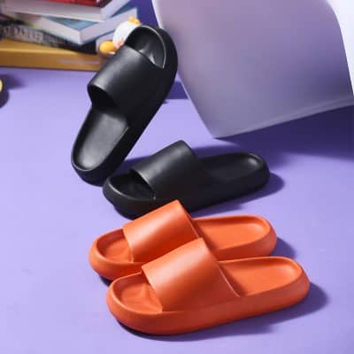 Stylish and comfortable slide sandals in black and orange for casual wear and everyday comfort. Perfect for indoor and outdoor use.