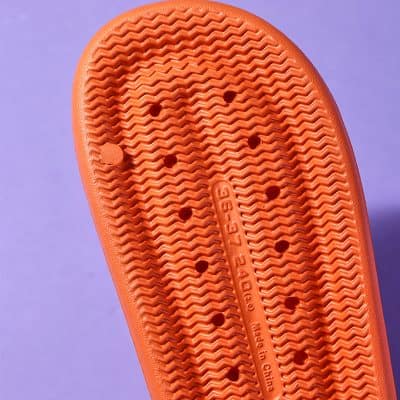 Bright orange slip-on slippers with textured soles for comfort and durability. Perfect for casual wear, hospital, spa, or home use. Easy to clean and lightweight.