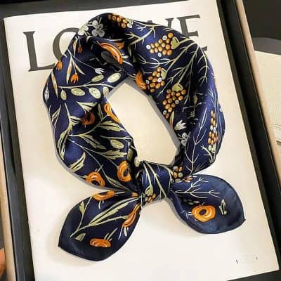 High-quality navy silk scarf with floral and botanical prints, perfect for fashion accessories and everyday wear, ideal for enhancing your style.