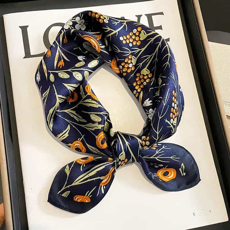 High-quality navy silk scarf with floral and botanical prints, perfect for fashion accessories and everyday wear, ideal for enhancing your style.
