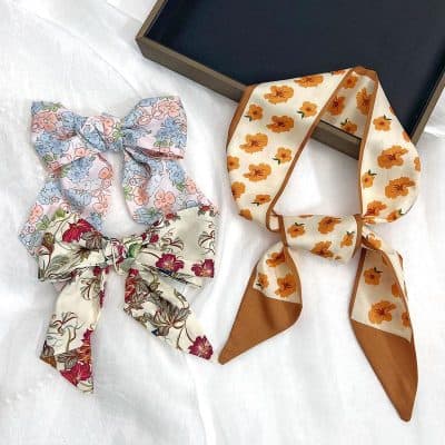 Vibrant floral hair scarves crafted from lightweight fabric, perfect for adding a stylish touch to your hairstyle. Ideal for daily wear or special occasions, these scarves combine comfort and fashion.