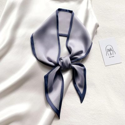 Luxurious silk scarf with sophisticated design, perfect for enhancing your style and skincare routine at Monalisa Medical. Ideal accessory for a polished, fashionable look.