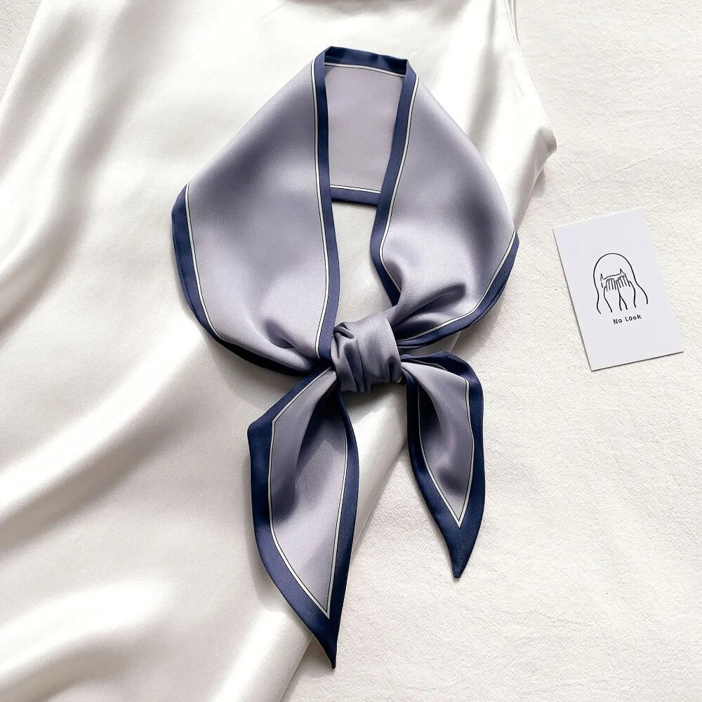 Luxurious silk scarf with sophisticated design, perfect for enhancing your style and skincare routine at Monalisa Medical. Ideal accessory for a polished, fashionable look.