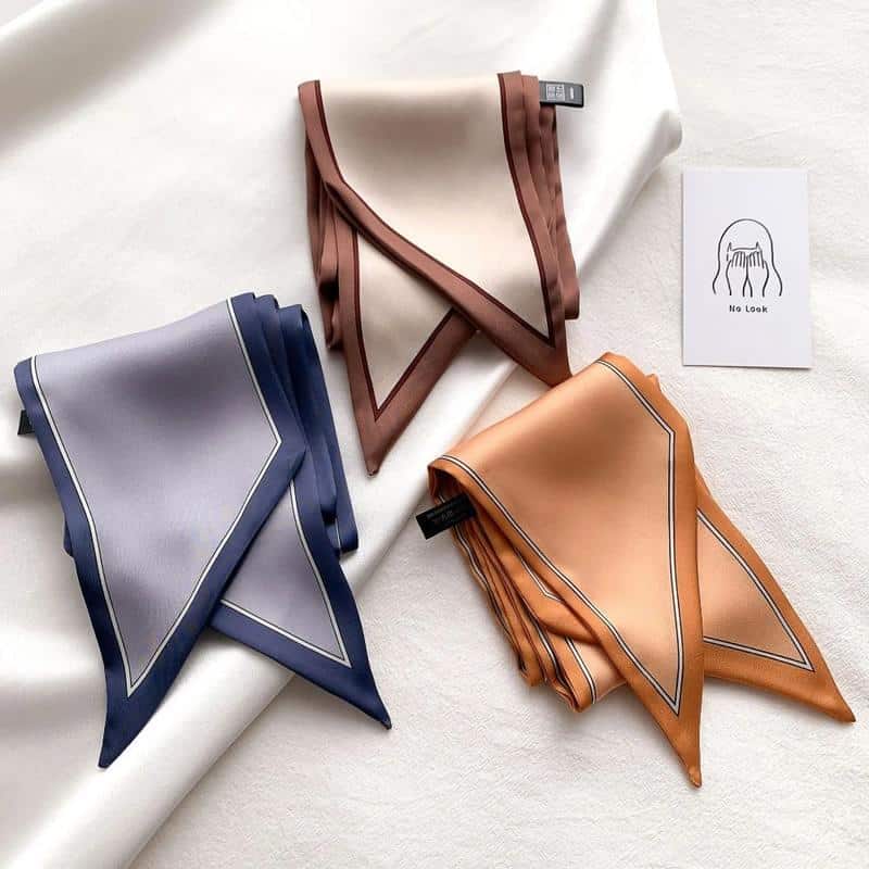 Luxury silk scarves in brown, blue, and orange, ideal for women’s fashion accessories. Add a touch of elegance to your wardrobe with high-quality, stylish scarves from Monalisa Store. Perfect for dressing up any outfit.