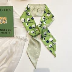 Luxurious green floral silk scarf perfect for stylish accessories and face mask replacement, enhancing your fashion statement with quality and comfort.