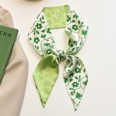 Fashionable green floral patterned silk scarf for women, perfect for accessorizing and enhancing any outfit with a touch of elegance.