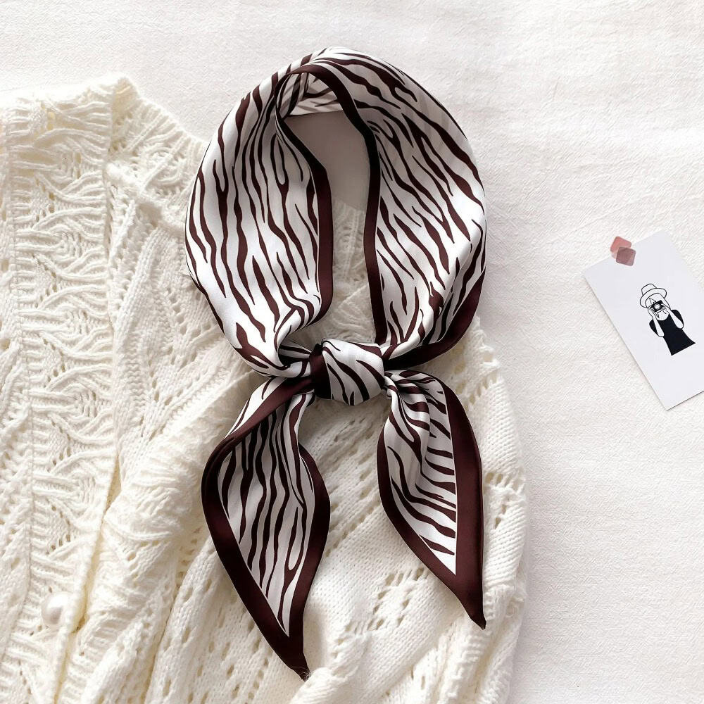 Luxurious zebra pattern silk scarf ideal for women’s fashion accessories, versatile styling, and elegant look. Perfect for enhancing outfits with trendy and sophisticated accessories.