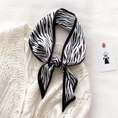 Elegant black and white zebra-patterned silk scarf perfect for stylish fashion accessories.