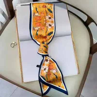 Vibrant yellow silk scarf with floral patterns, perfect for stylish women. Shop high-quality scarves at Monalisa Store for a chic and fashionable look.