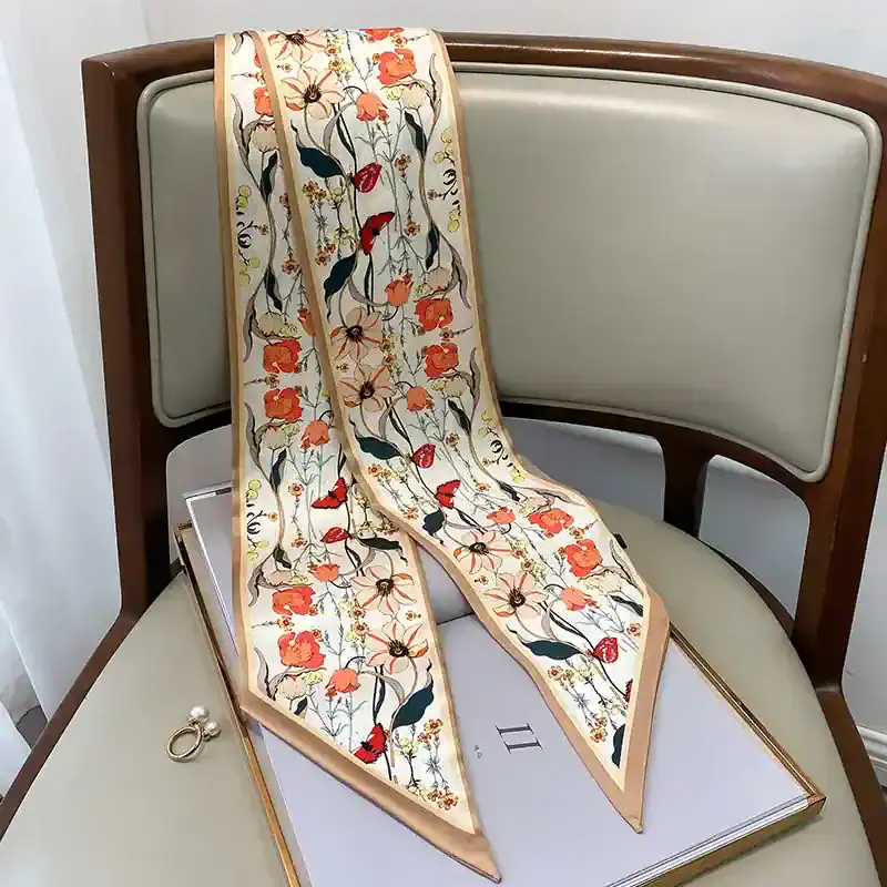 Fine silk floral scarf with vibrant red, orange, and green patterns, perfect for fashion accessories and gift ideas. Enhance your style with this luxurious, high-quality silk scarf.