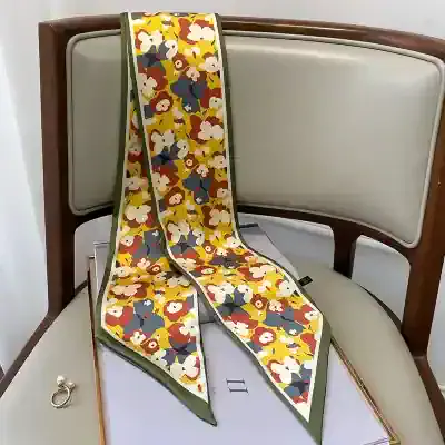 Luxury floral print silk scarf with vibrant colors and soft texture, perfect for stylish accessories and fashion statements.