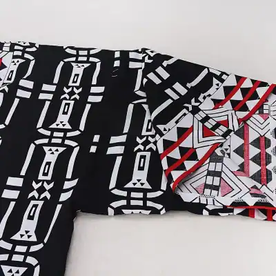 Stylish geometric patterned scarf featuring black, white, and red colors, ideal for adding a trendy touch to your outfit and daily fashion accessories.